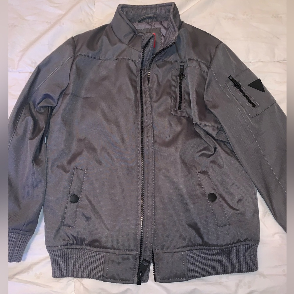 Boy’s gray with black bomber style jacket by Guess size 6. Like new condition.